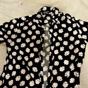 A barely worn bottom up shirt. No rips or holes. Good condition.